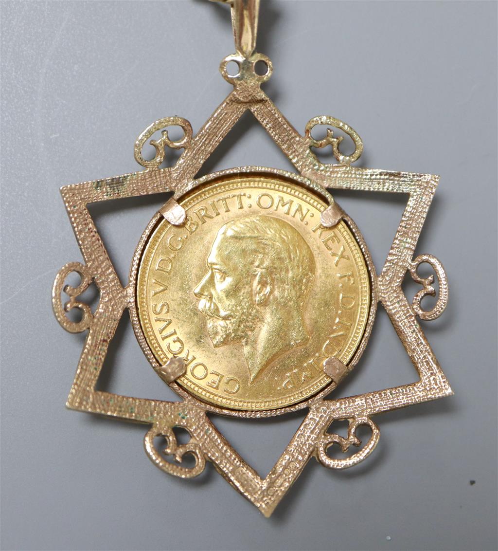 A 1932 gold sovereign, Pretoria Mint, in Star of David 9ct gold mount on yellow metal chain,